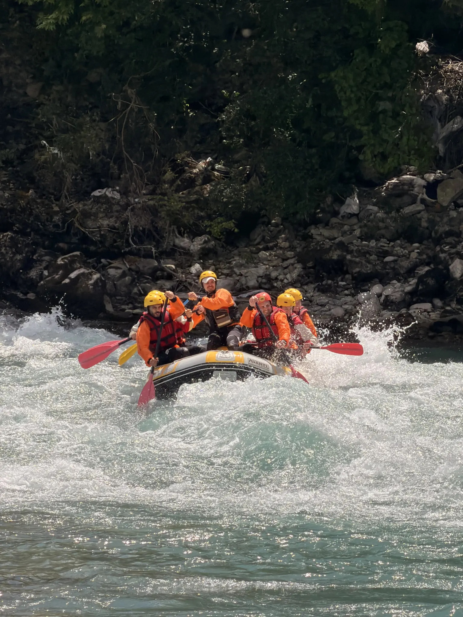 Raft in a rapid on the Vjosa River between limestone banks, Përmet