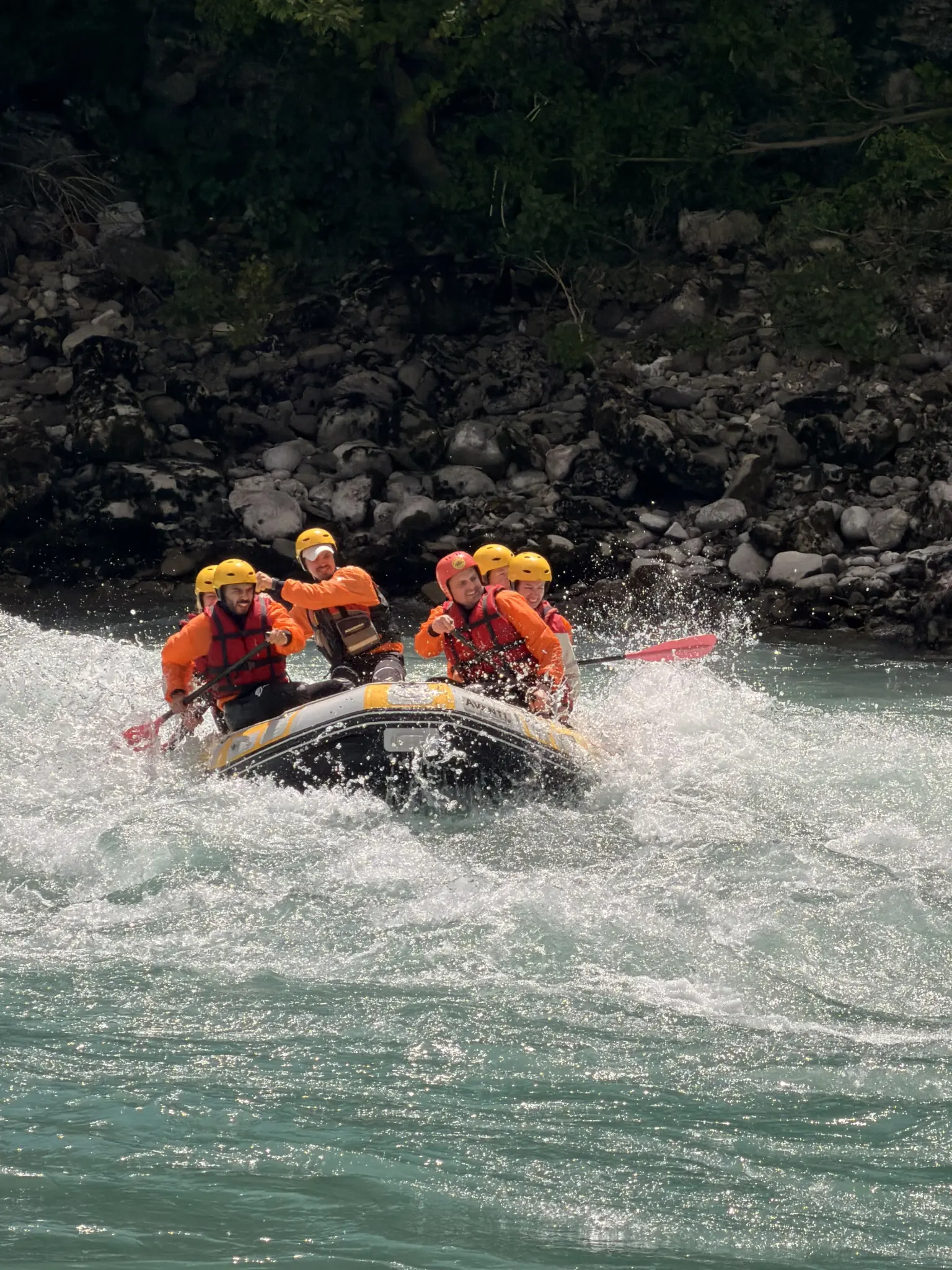 Raft crew dropping into a rapid on the Vjosa River, southern Albania